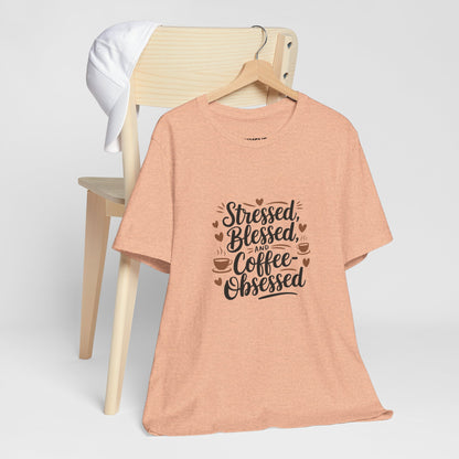 "Stressed, Blessed & Coffee-Obsessed" Unisex Short Sleeve Tee – Because Coffee is a Lifestyle -color - Heather Peach - available in USA